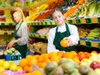 teenager working in the produce section of a grocery store