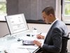 Accountant in a wheelchair working at a desk