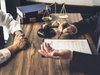 lawyer at a desk going over a contract