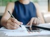 Woman writing a business plan