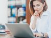 woman looking at a laptop