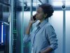 woman standing in front of a computer server