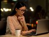 woman typing on a laptop