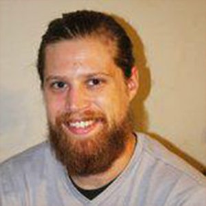 headshot of Adam Uzialko