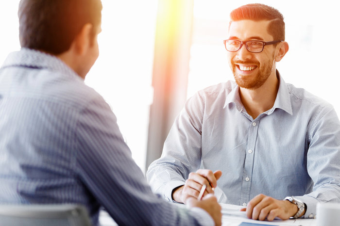 Person Smiling In Meeting